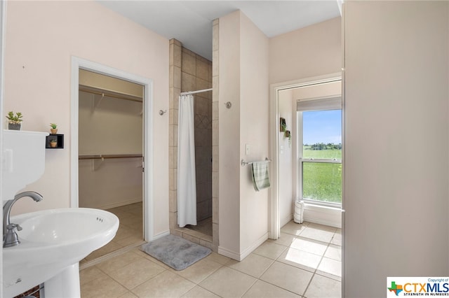 bathroom with sink, tile patterned floors, and a shower with shower curtain