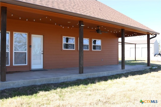 exterior space with ceiling fan and a patio area