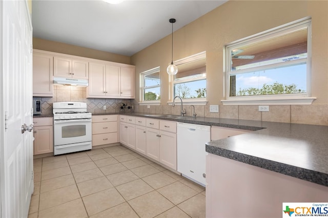 kitchen with sink, decorative light fixtures, white appliances, decorative backsplash, and white cabinets