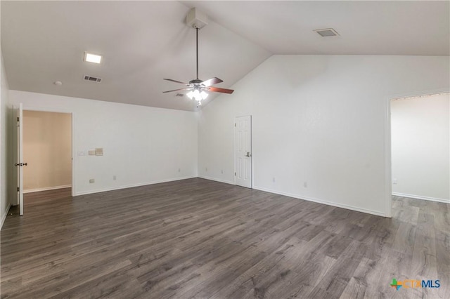 empty room with dark wood-type flooring, visible vents, and a ceiling fan