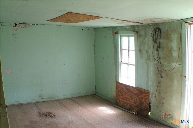 spare room featuring hardwood / wood-style floors