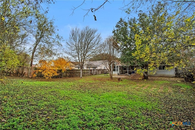 view of yard featuring a sunroom