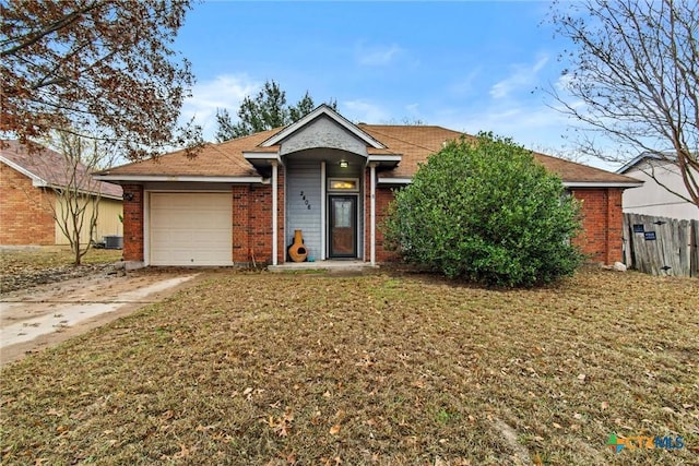 view of front of property featuring a garage, central air condition unit, and a front lawn