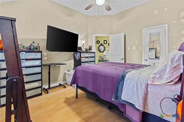 bedroom with ceiling fan and wood-type flooring