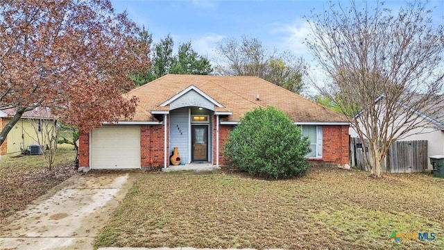 view of front of house featuring central AC unit and a garage