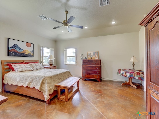 bedroom featuring a textured ceiling and ceiling fan