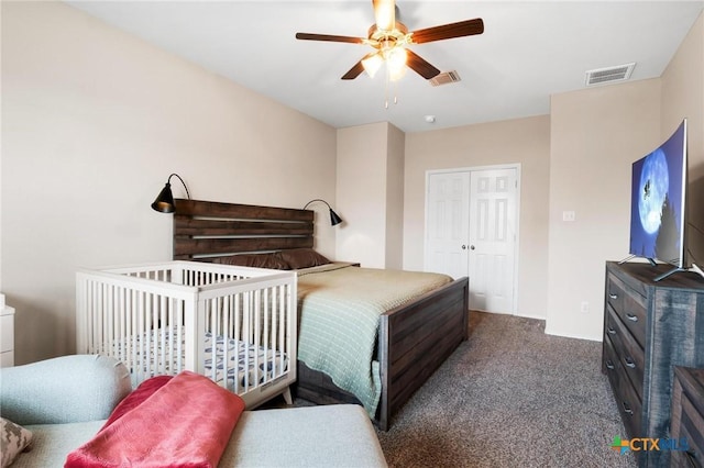 bedroom with carpet floors, a ceiling fan, and a closet
