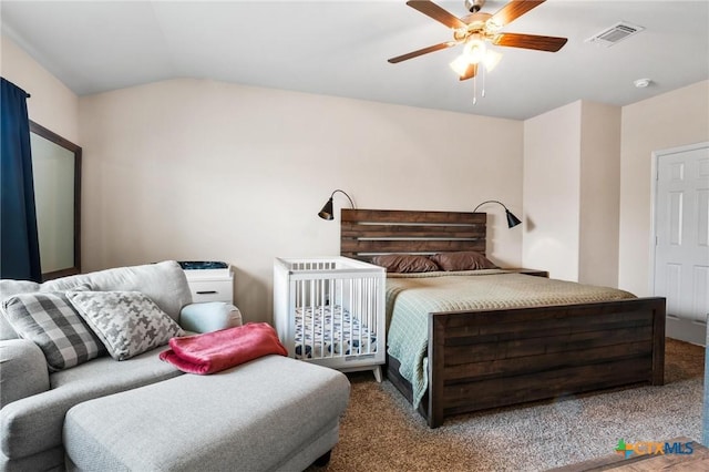 bedroom featuring carpet, lofted ceiling, and a ceiling fan