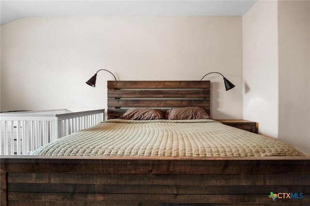 bedroom featuring vaulted ceiling