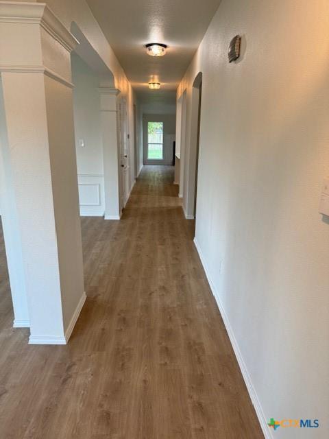 500 Chickasaw Dr, Harker Heights, TX 76548 - hallway featuring wood finished floors and arched walkways