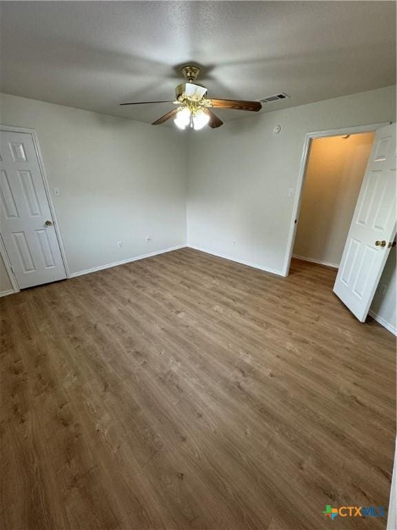 500 Chickasaw Dr, Harker Heights, TX 76548 - unfurnished bedroom featuring wood finished floors and a ceiling fan