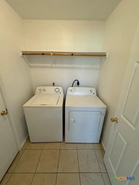 500 Chickasaw Dr, Harker Heights, TX 76548 - laundry area featuring washer and clothes dryer and light tile patterned flooring