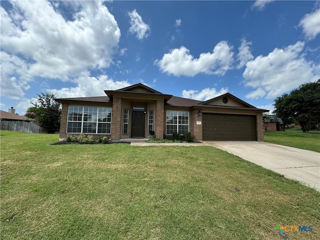 500 Chickasaw Dr, Harker Heights, TX 76548 - ranch-style house with brick siding, driveway, and an attached garage