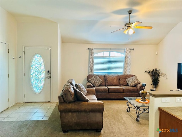 living room with ceiling fan and light tile patterned floors