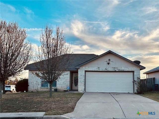 ranch-style house featuring a garage