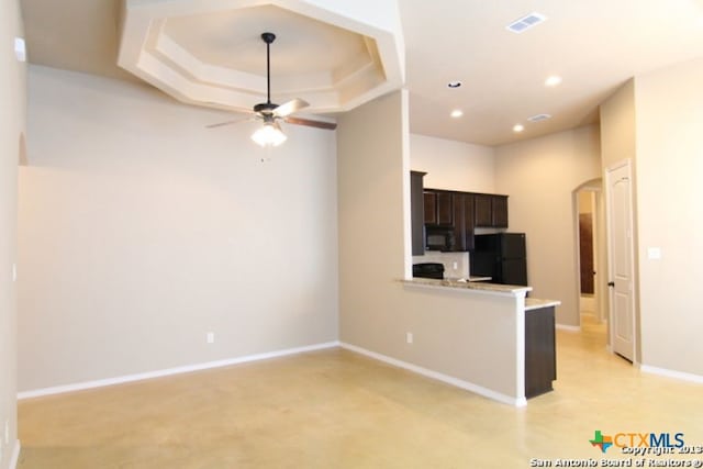 260-262 Rosalie Dr, New Braunfels, TX 78130 - kitchen with visible vents, arched walkways, light countertops, ceiling fan, and black appliances