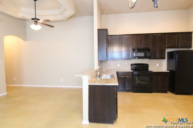 260-262 Rosalie Dr, New Braunfels, TX 78130 - kitchen featuring dark brown cabinets, a ceiling fan, black appliances, a sink, and decorative backsplash