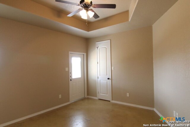 260-262 Rosalie Dr, New Braunfels, TX 78130 - unfurnished room with baseboards, a raised ceiling, ceiling fan, and finished concrete flooring