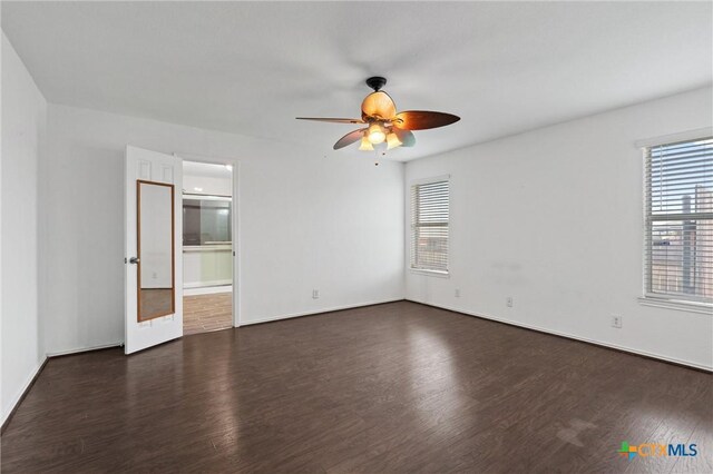 4401 Maggie Dr, Killeen, TX 76549 - spare room with dark wood finished floors, ceiling fan, and baseboards