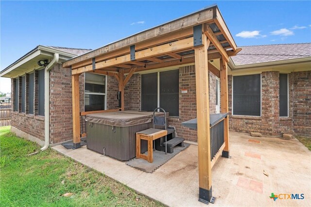 4401 Maggie Dr, Killeen, TX 76549 - view of patio / terrace with a hot tub