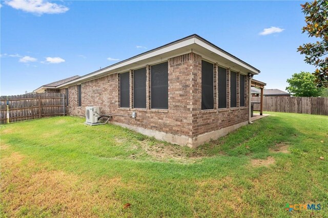 4401 Maggie Dr, Killeen, TX 76549 - view of home's exterior featuring brick siding and ac unit