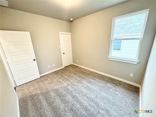 view of carpeted spare room