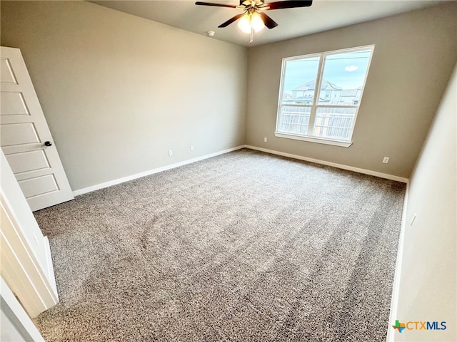 carpeted empty room with ceiling fan