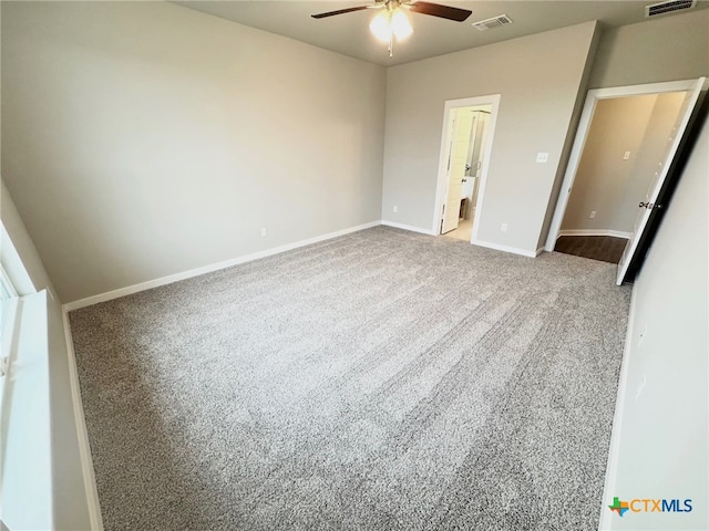 unfurnished bedroom with ensuite bathroom, carpet floors, and ceiling fan