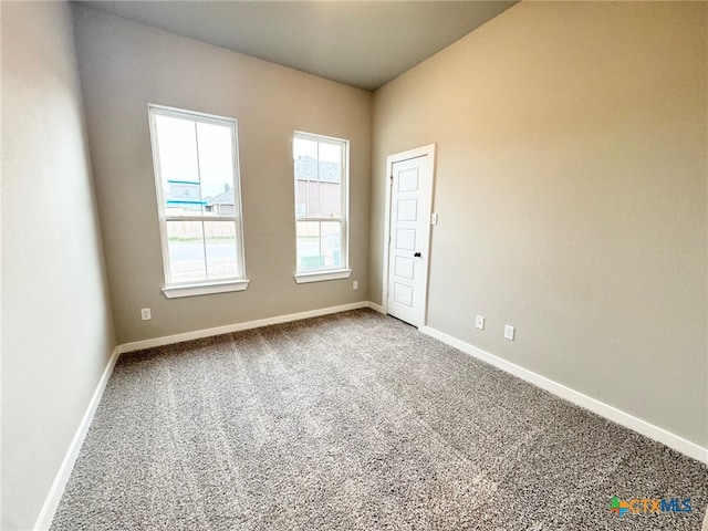 unfurnished room featuring carpet flooring