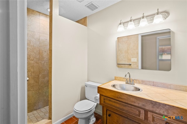 105 Creekside Dr, Victoria, TX 77904 - full bath featuring vanity, tiled shower, and tile patterned floors