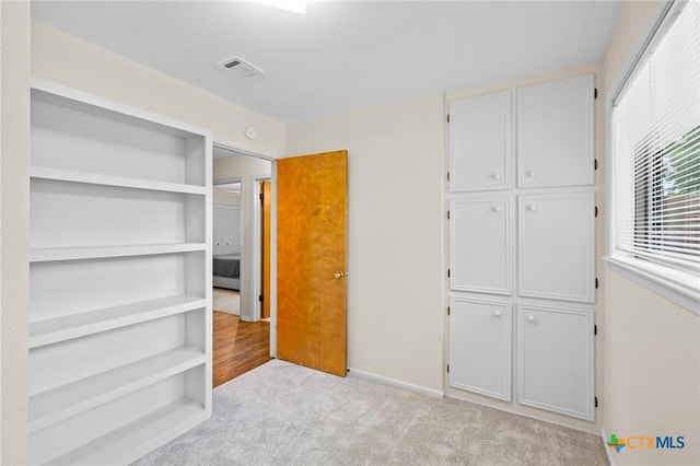 105 Creekside Dr, Victoria, TX 77904 - unfurnished bedroom featuring light carpet