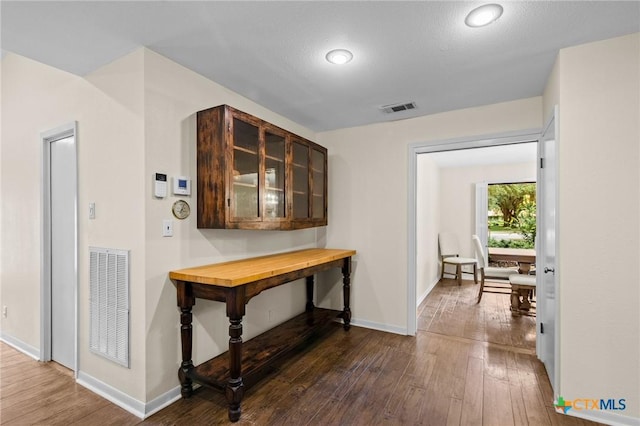 105 Creekside Dr, Victoria, TX 77904 - hallway featuring dark wood-style floors and baseboards
