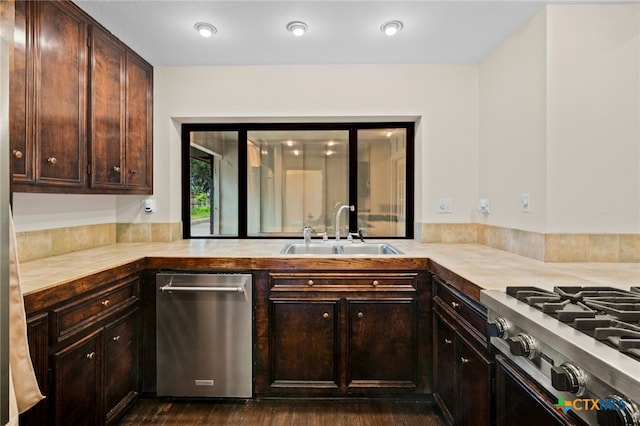 105 Creekside Dr, Victoria, TX 77904 - kitchen featuring stainless steel dishwasher, dark brown cabinetry, and dark wood-style floors