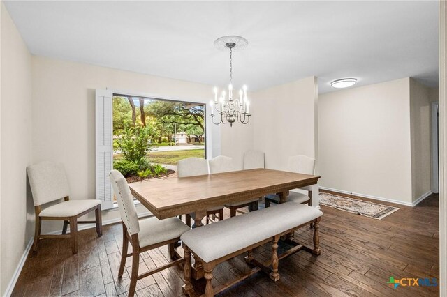 105 Creekside Dr, Victoria, TX 77904 - dining room with dark wood-style floors and a chandelier