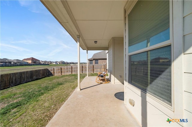 view of patio / terrace featuring a residential view and a fenced backyard