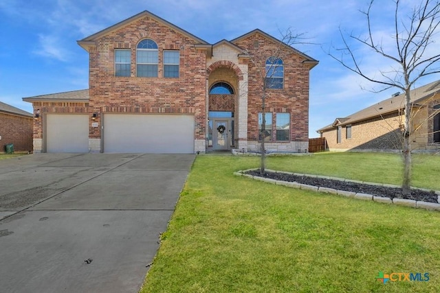 view of front facade featuring driveway, a garage, a front lawn, and brick siding