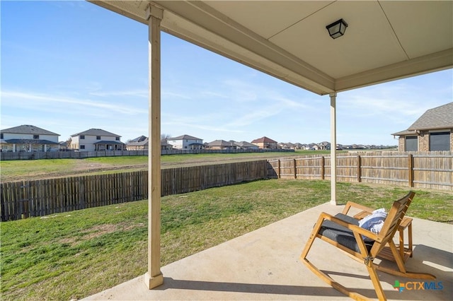 view of patio / terrace with a fenced backyard and a residential view