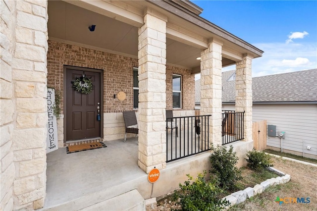 doorway to property featuring a porch