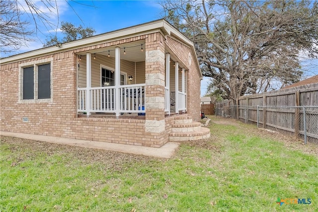 view of home's exterior with a lawn