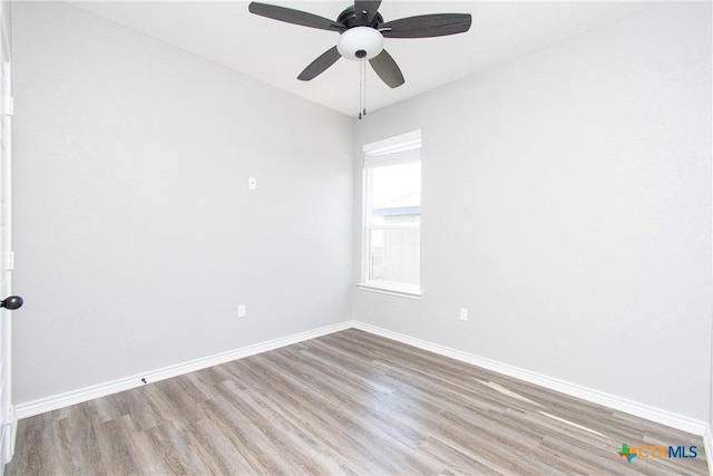 spare room with ceiling fan and light hardwood / wood-style flooring