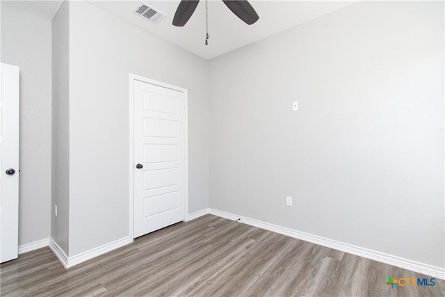 unfurnished room with hardwood / wood-style flooring and ceiling fan