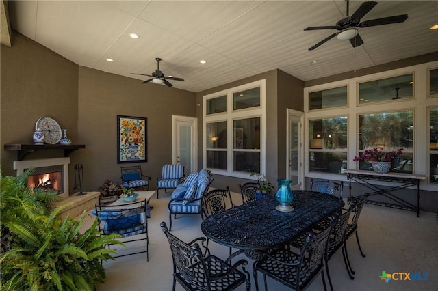 2319 Geneseo Oaks, New Braunfels, TX 78132 - view of patio / terrace featuring a ceiling fan and an outdoor living space with a fireplace