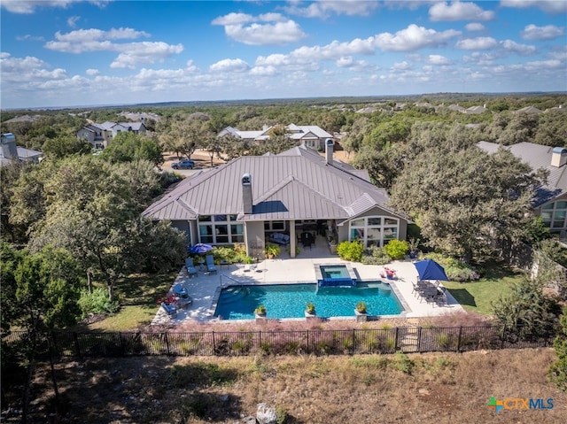 2319 Geneseo Oaks, New Braunfels, TX 78132 - view of swimming pool featuring a patio area, a pool with connected hot tub, and a fenced backyard