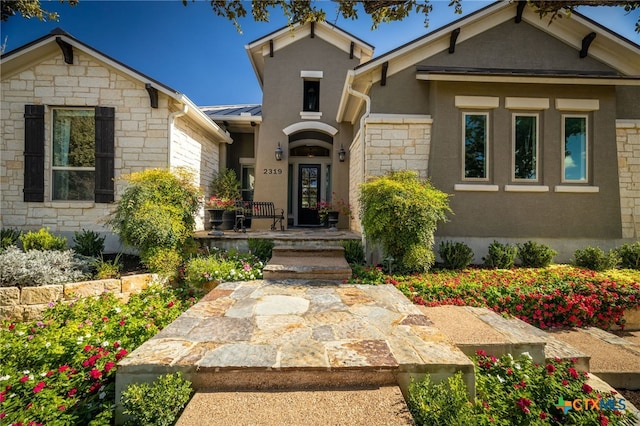 2319 Geneseo Oaks, New Braunfels, TX 78132 - view of front of property featuring stucco siding, stone siding, metal roof, and a standing seam roof