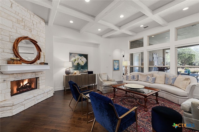 2319 Geneseo Oaks, New Braunfels, TX 78132 - living room with arched walkways, coffered ceiling, a stone fireplace, and hardwood / wood-style flooring