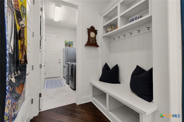 2319 Geneseo Oaks, New Braunfels, TX 78132 - mudroom featuring dark wood-style floors, washing machine and dryer, and baseboards