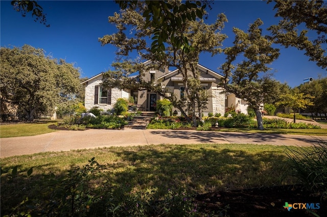 2319 Geneseo Oaks, New Braunfels, TX 78132 - view of front of home featuring a front yard and stone siding