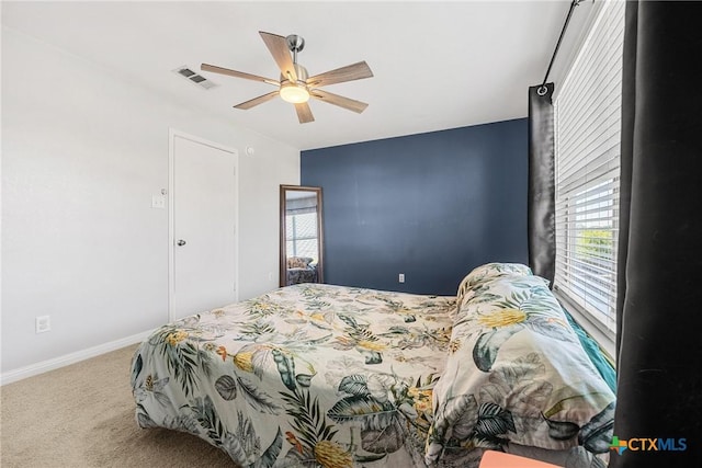 3410 Regency Ct, Killeen, TX 76549 - carpeted bedroom with multiple windows, baseboards, and a ceiling fan