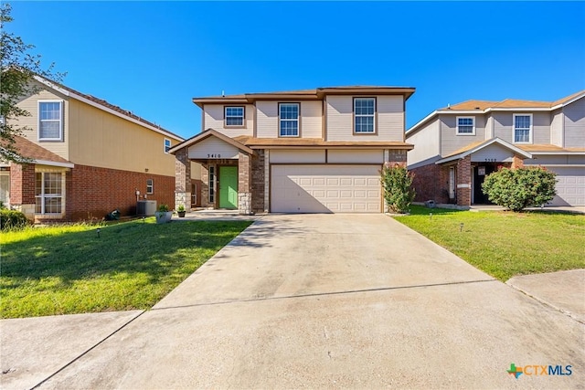 3410 Regency Ct, Killeen, TX 76549 - traditional home with a garage, driveway, a front yard, central air condition unit, and stone siding