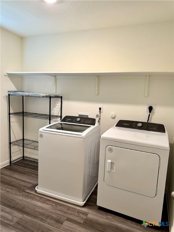 washroom featuring washer and dryer and dark hardwood / wood-style flooring